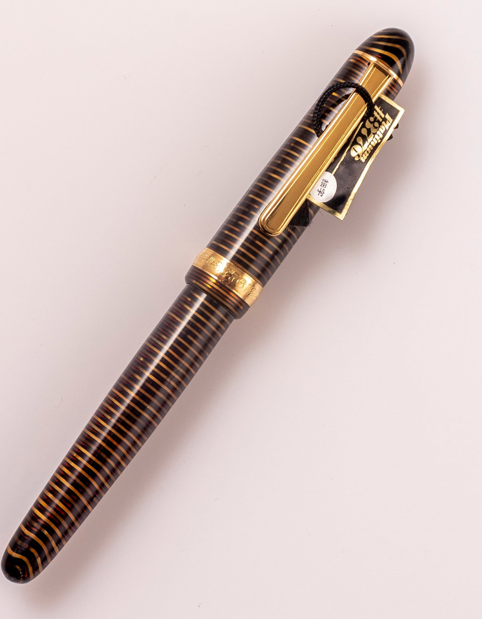Platinum Fountain Pen, 3776: Platinum 3776 Celluloid fountain pen, Cha-Ringu pattern (striped black and gold), gold plated trims. Size: 5.3" (13.5 cm). 18K gold nib, F. Mint condition, NOS.