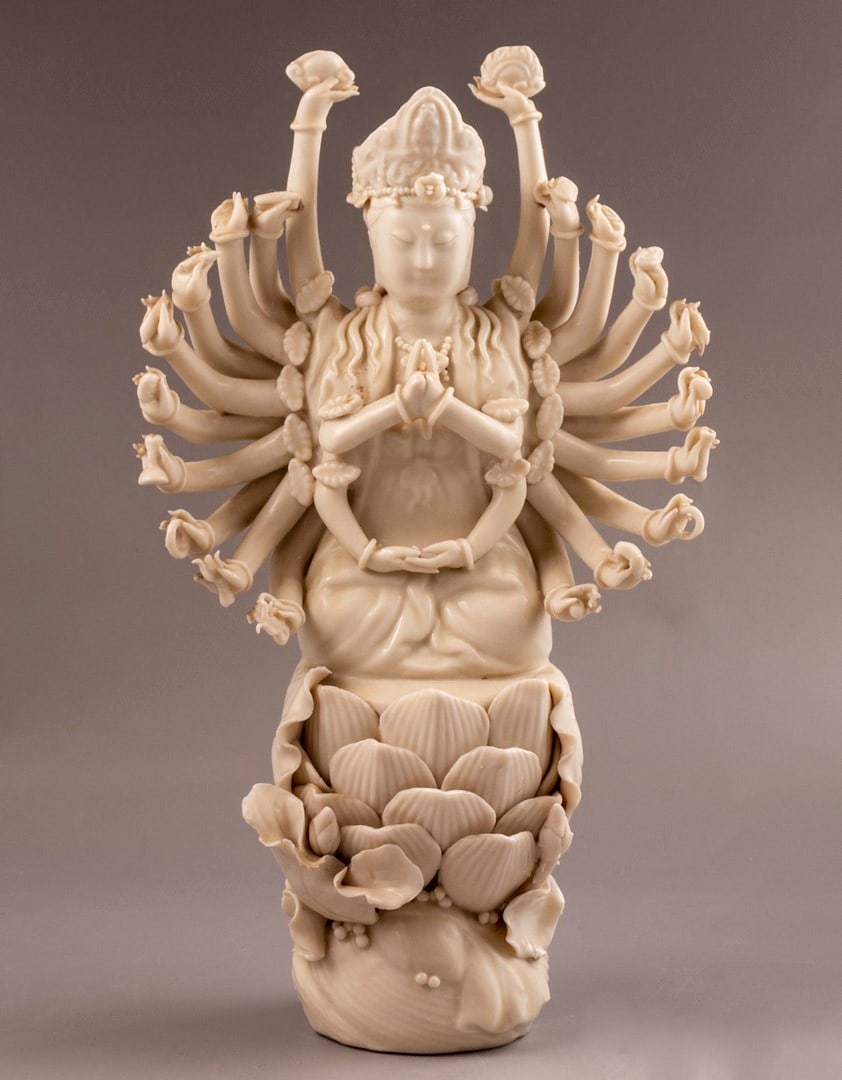 Chinese Porcelain Sculpture - Doumu: Chinese 19th century porcelain sculpture in the form of the multi armed goddess Doumu seated on a lotus throne. Height: 24.5 cm. Minute flaws to the lotus throne. Purchased at "Zacke" Gallery in Vienn
