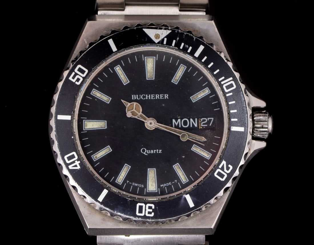 Bucherer Watch: Men's watch made by Bucherer. Quartz movement, reference number 15425. Metal strap. Diameter: 36 mm. Unknown mechanical condition.