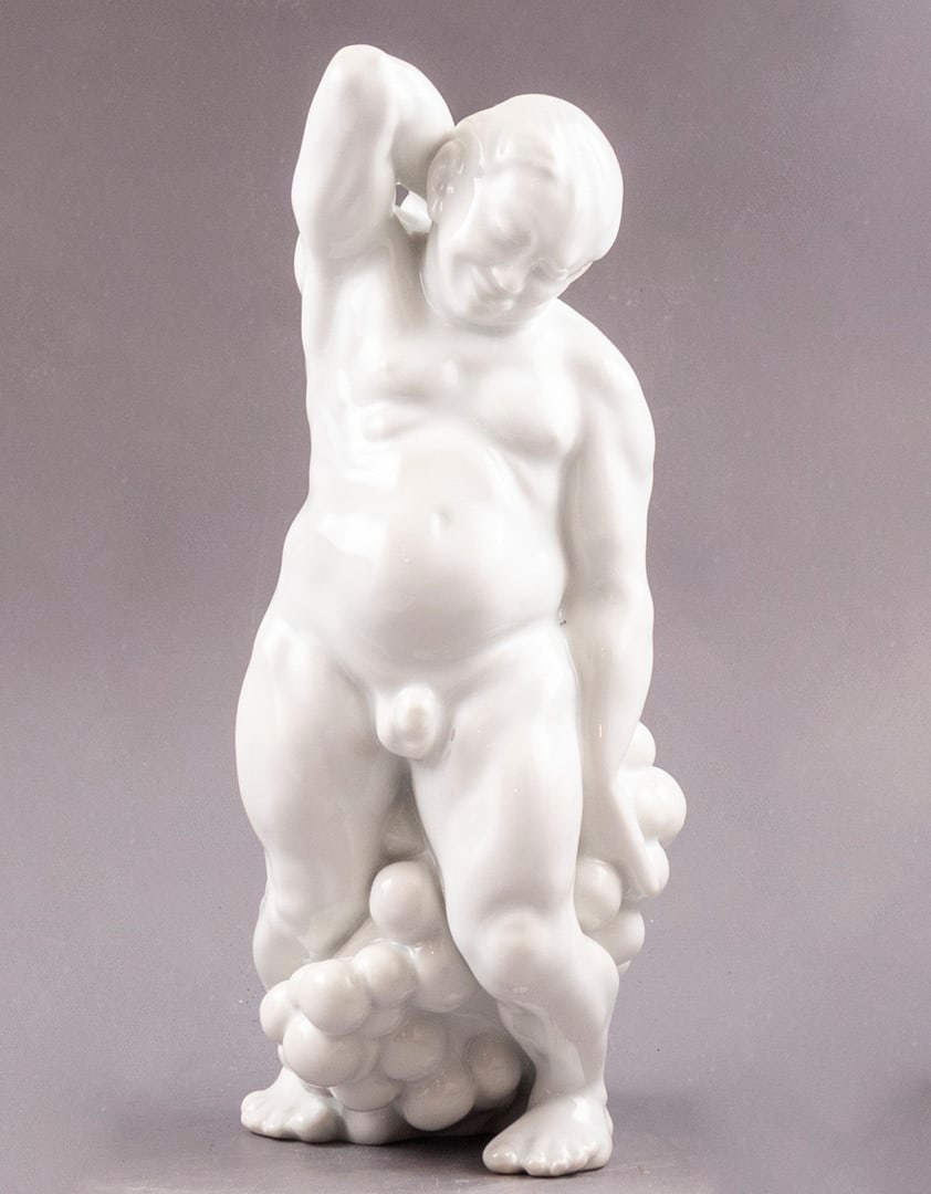 Porcelain Figurine, Designed by Kai Nielsen for Bing & Grondahl: Porcelain figurine designed by Kai Nielsen for Bing & Grondahl. In the form of Bacchus with grapes. Height: 22.5 cm. Marked.