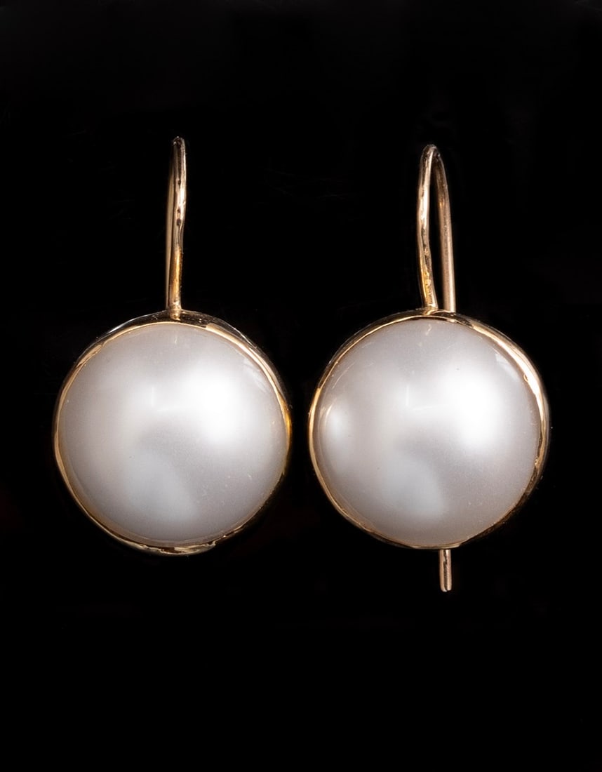 Gold & Pearl Earrings: Pair of 14K gold earrings, set with Moby pearls (15 mm). Diameter: 17 mm, Weight: 6.6g. Unmarked, tested gold.