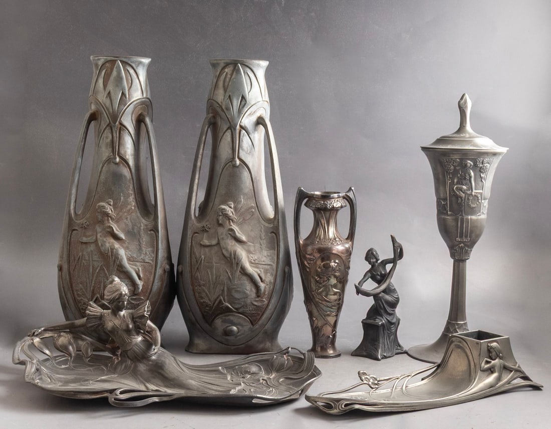 Art-Nouveau Items: Lot of 7 Pewter Art-Nouveau items, including: 2 vases designed by J. Garnier, a goblet with a lid, an inkwell, a sculpture in the form of a woman, a vase and a tray. Decorated with female figures and