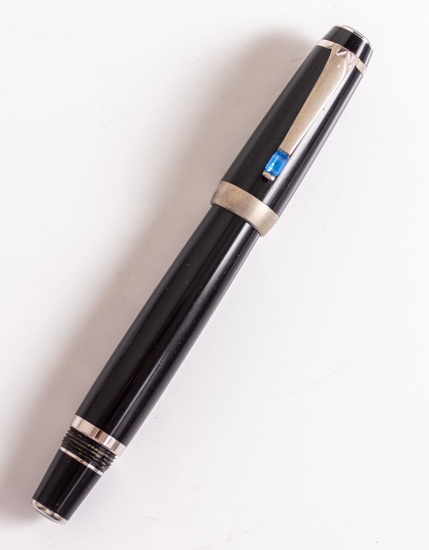 Montblanc Boheme Blue Sapphire Fountain Pen: Montblanc Boheme fountain pen, Black, clip set with a sapphire. Size: 4.85" (12.3 cm). 14K white gold nib, B. Excellent condition.