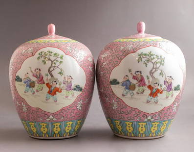 Chinese Porcelain Vases: Pair of Chinese porcelain vases, Famille rose, early Republic. Hand painted with figures in various scenes. Height: 29 cm. Signed.