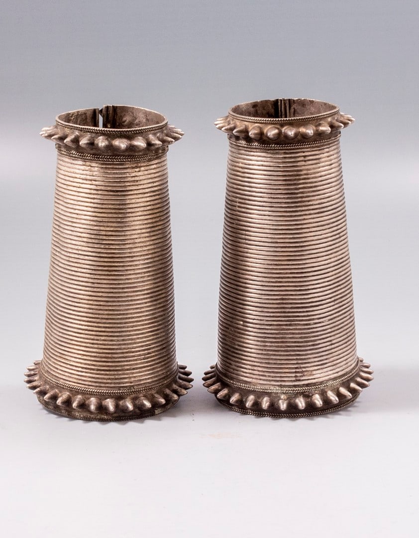 Indian Ethnic Silver Bracelets: Pair of Indian (Pushkar) silver cuff bracelets. Width: 11 cm. Diameter: 5.5-8 cm. Total weight: 525 grams. Unmarked, tested silver. Minor flaws.