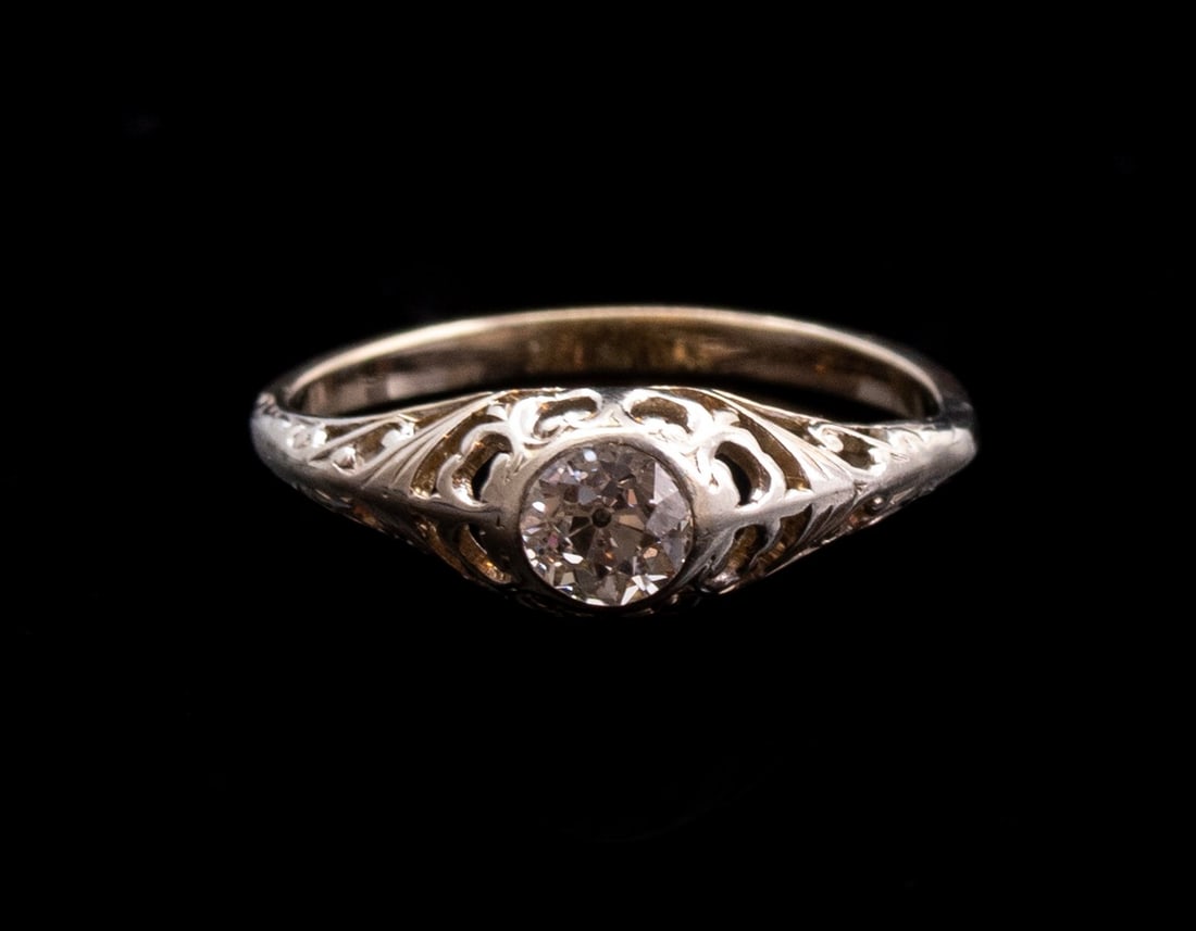 Gold Diamond Ring: 14K gold ring set with an old-cut diamond weighing about 35 points. Size: 1/4 6 US, Weight: 1.7 grams. Unmarked, gold tested.