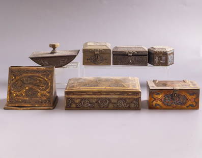Damascene Brass Items: Lot of 7 Islamic brass items, inlaid with silver and copper (Damascene). Including boxes, a cigarette dispenser and an ink blotter. Decorated with calligraphic and floral motifs and arabesques. Dimens