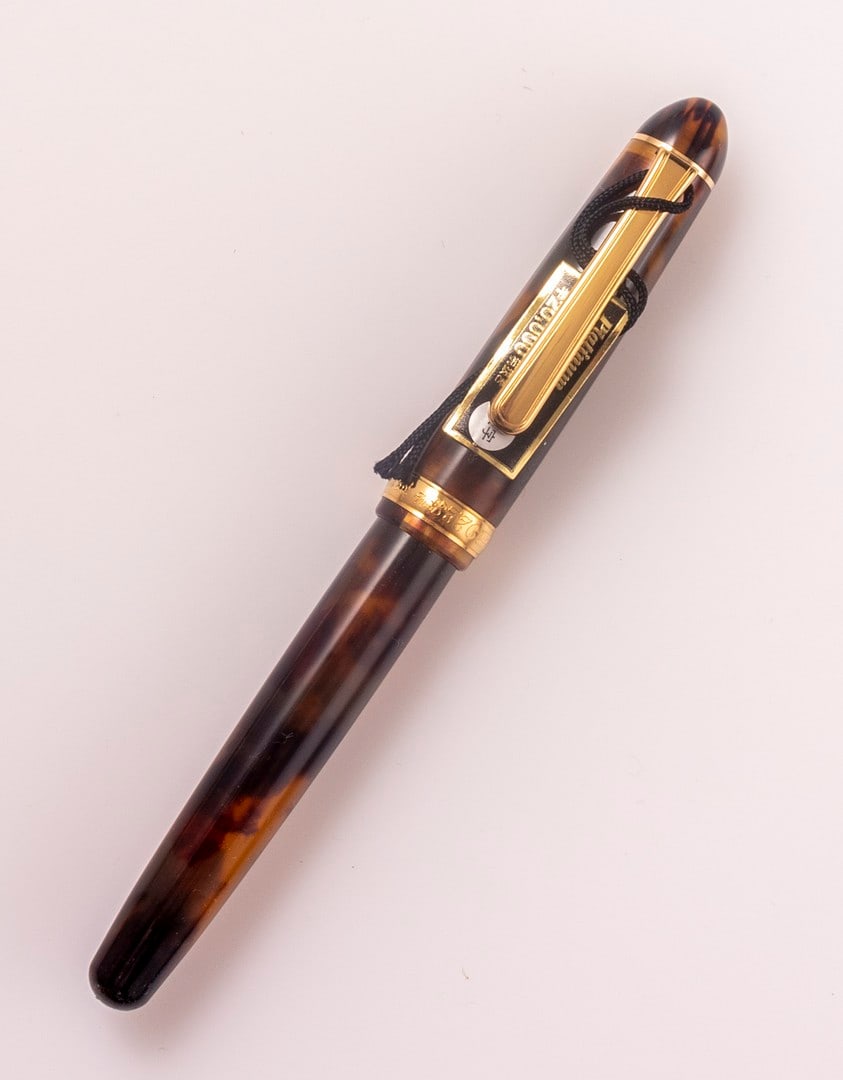 Platinum Fountain Pen, 3776: Platinum 3776 Celluloid fountain pen, tortoise shell color, gold plated trims. Size: 5.3" (13.5 cm). 18K gold nib, B. Mint condition, NOS, NWT.