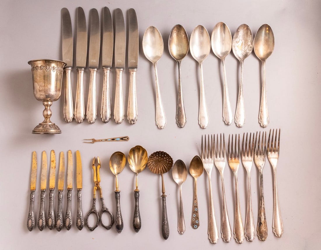 Silver Items: Lot of silver items, most of them are German 800 silver, including a goblet and flatware parts, mostly made by Bruckmann & Söhne. Height/length: 9–14 cm. Total weight: 926 grams. In addition, flatw