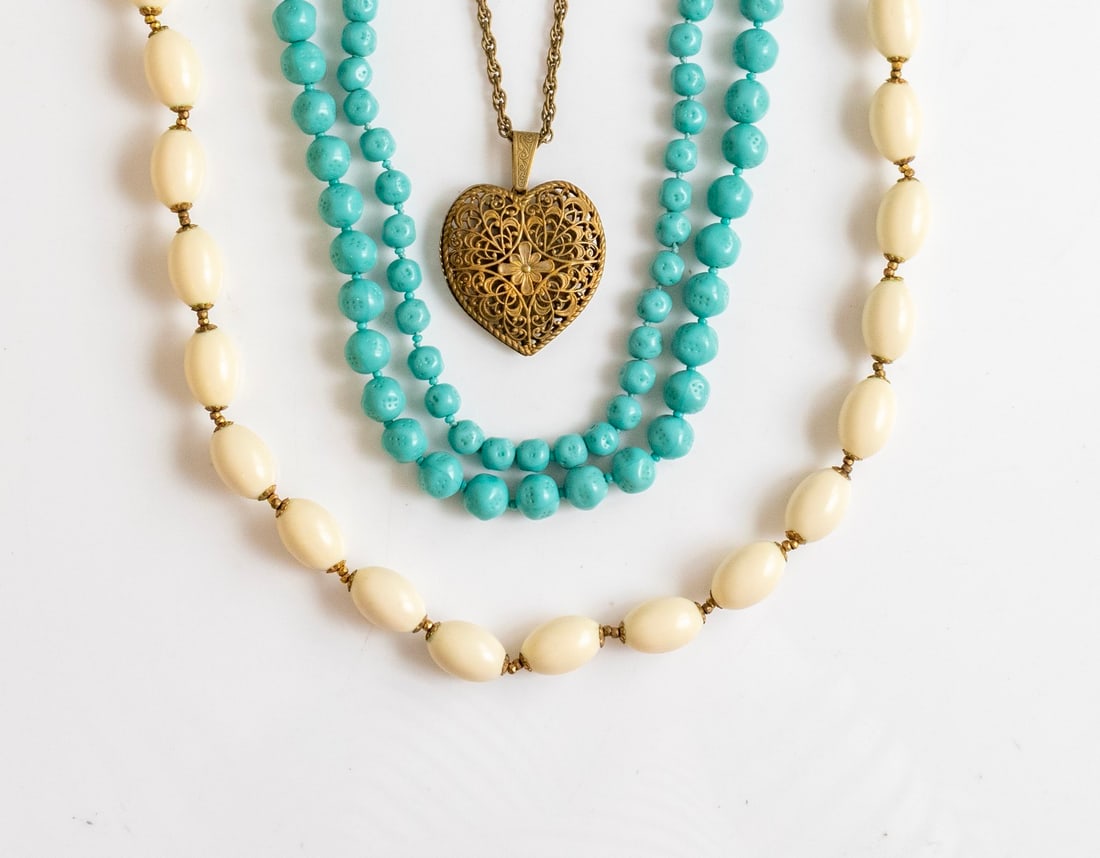 Miriam Haskell Necklaces: Lot of 3 Necklaces by Miriam Haskell. Made of various materials including glass, plastic, and heart-shaped metal. Length: 50-130 cm. Signed.