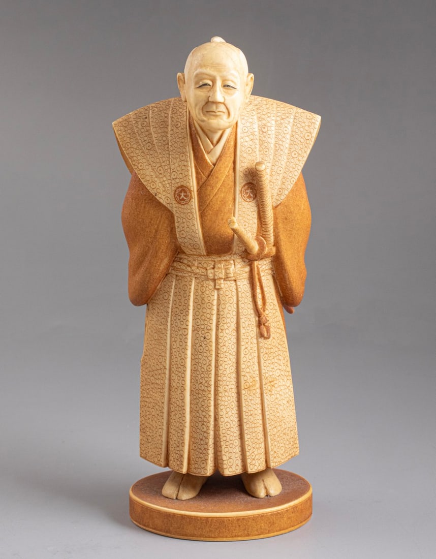Carved Japanese Okimono: Fine Japanese Okimono, carved in the form of a Samurai warrior. Height: 18 cm. Signed.