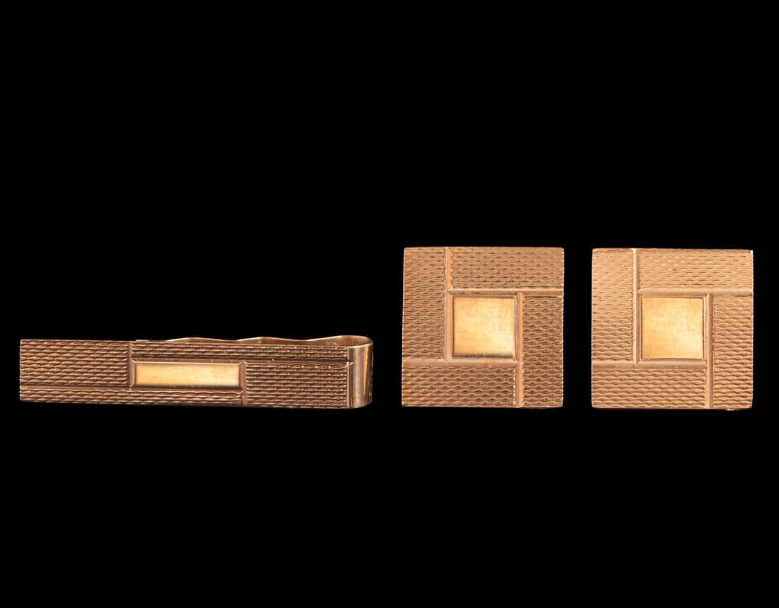 Gold Tie Pin & Cufflinks: 14K gold tie pin and pair of cufflinks by KBJC, decorated with engraved work. Dimensions: 19X41 mm. Weight: 15.1 grams. Hallmarked.