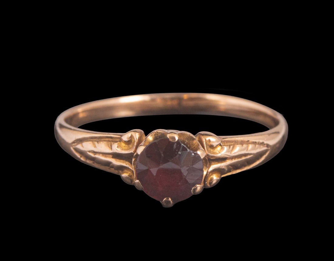 Gold Garnet Ring: 9K gold ring set with garnet. Size: 7.5 US, Weight: 1.7 g. Unmarked, the gold has been tested.
