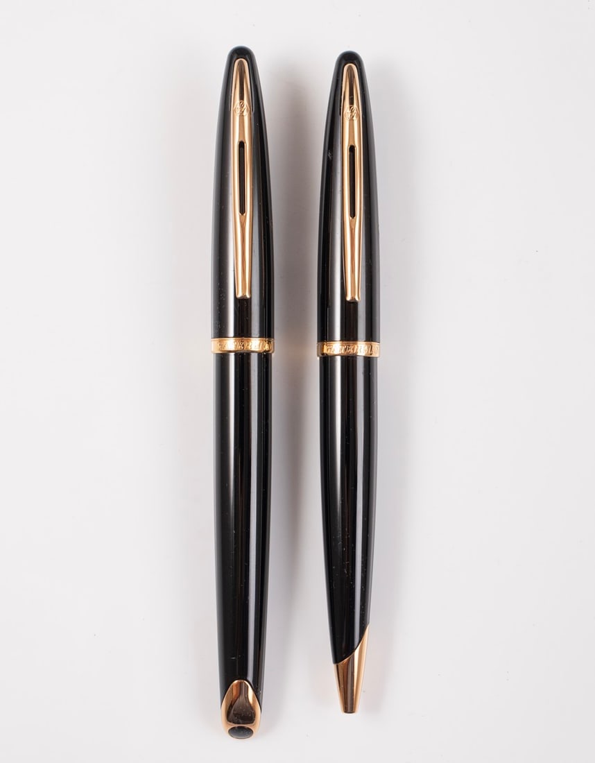 Waterman Carene Pens Set: Set of Waterman Carene fountain pen and rollerball, Black lacquer with GP trims. Size:5.65" (14.4 cm). 18K gold nib, F. Excellent condition, engraved Logo (?).