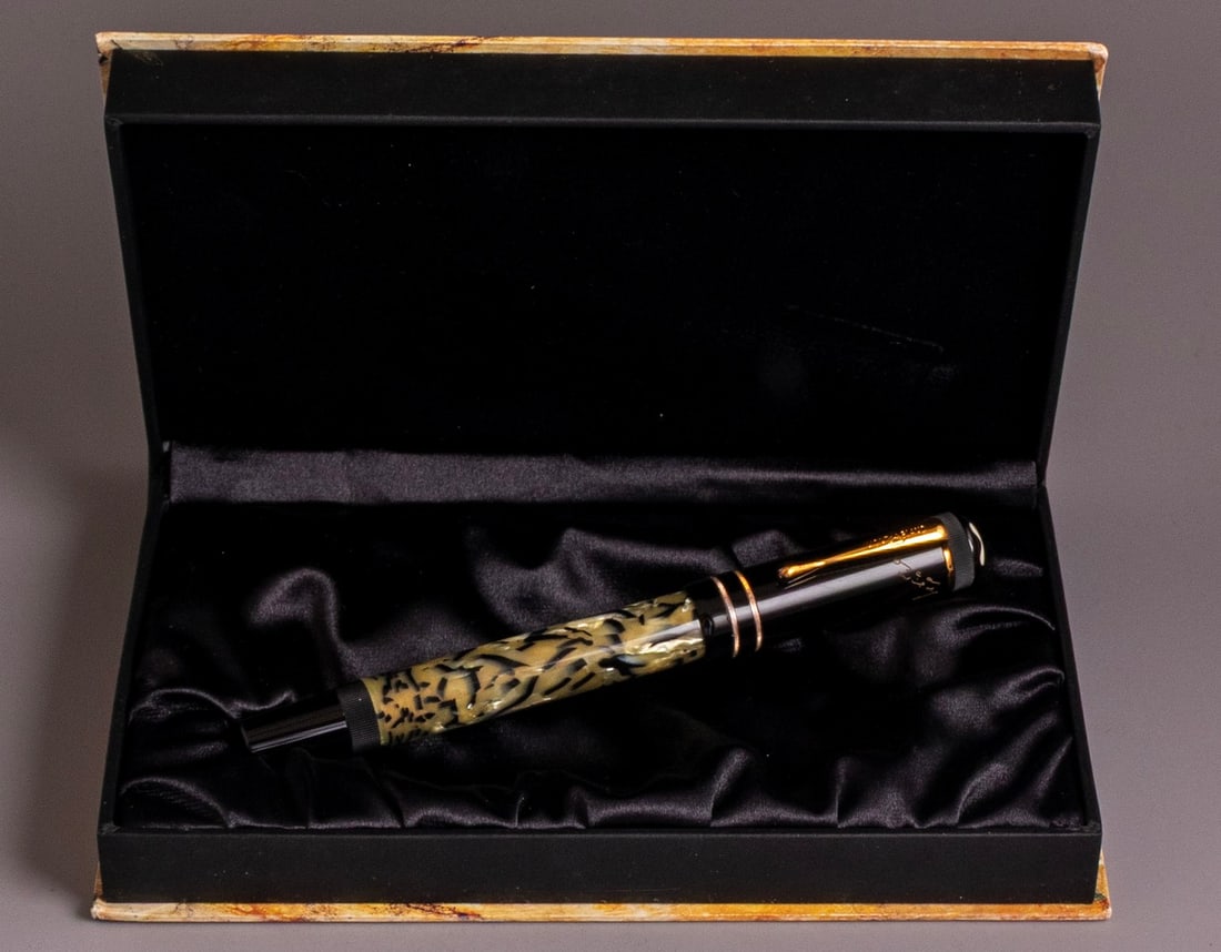 Montblanc Oscar Wilde Limited Edition Mechanical Pencil: Montblanc Writers edition Oscar Wilde fountain pen, marbled pearl and black with GP trims. Size: 5.7'' (14.5 cm). 18K gold nib, M. Very good condition, in original box with paper. Slight wear to the