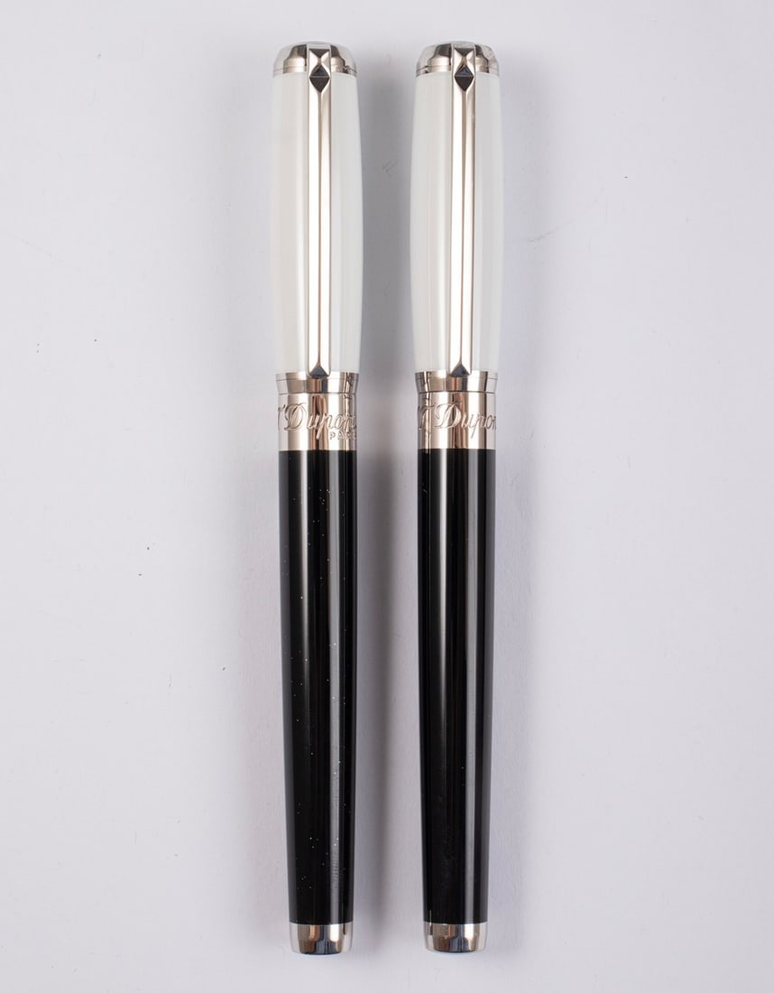 Dupont Humphrey Bogart Pen Set: S.T. Dupont set of Fountain and Rollerball Pens, Humphrey "Bogie" Bogart Special Edition. Size: 5.7" (14.5 cm), 14K White Gold nib, M. Mint, never inked, without box.