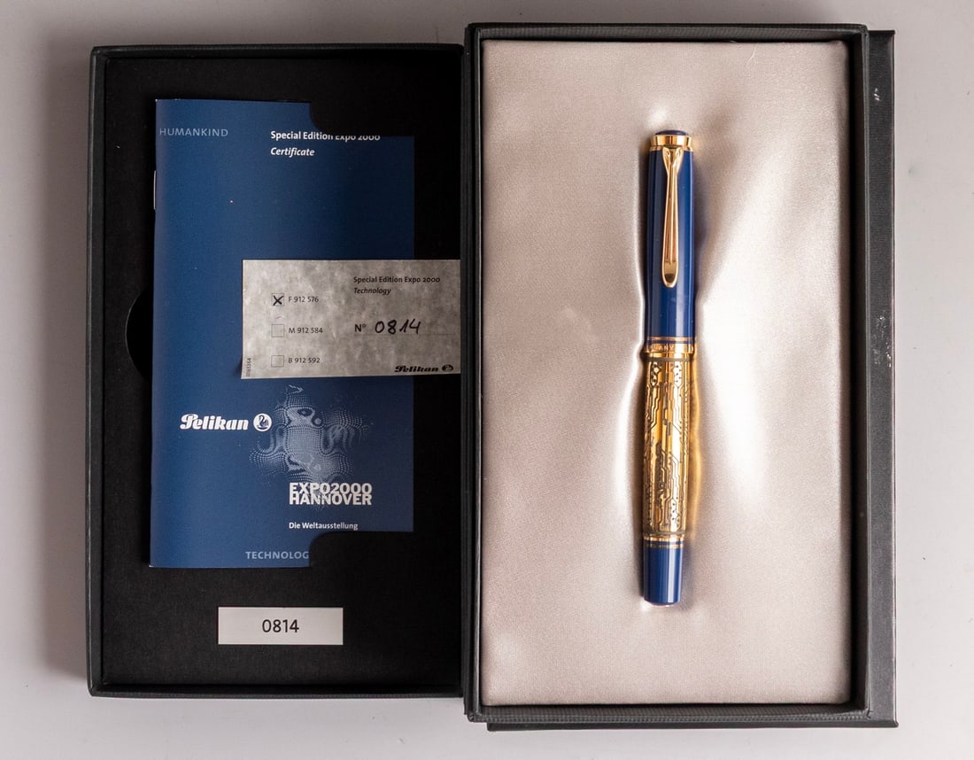 Pelikan M800 - Expo 2000 Technology Fountain Pen, Special Edition: Pelikan M800 - Expo 2000 Technology fountain pen, Special edition. Size: 5.55" (14.1 cm). 2 toned 18K gold nib, F. Numbered edition of 2000. Near Mint, in original case.