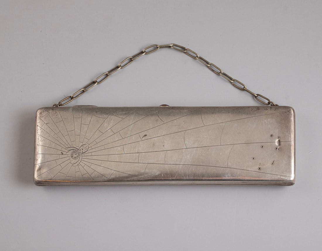 Russian Silver Purse: Russian 84 silver purse, circa 1900. Decorated on one side with engraved depiction of a spider with its web. Fabric interior. Dimensions: 20X6 cm. Total weight: approx. 303 grams. Hallmarked. Flaws.