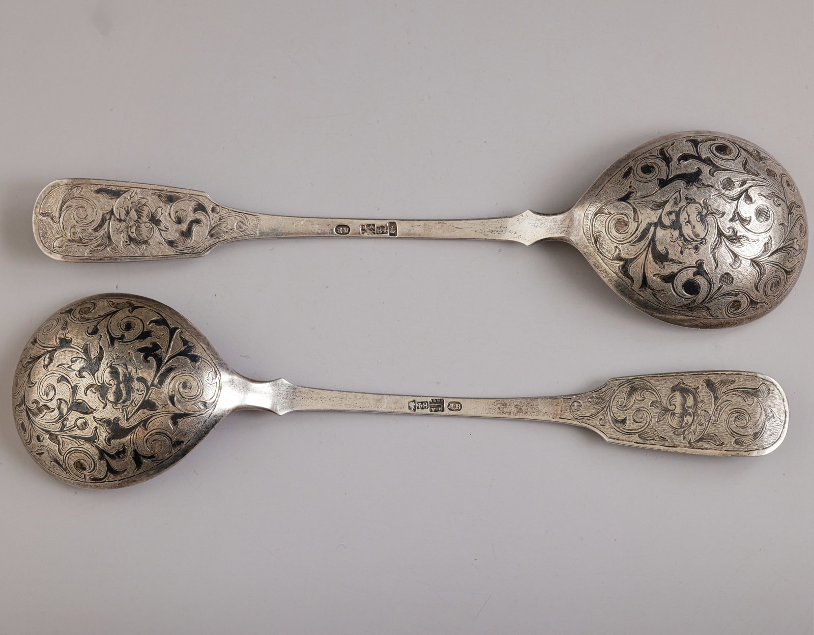 Russian Silver Spoons, Ivan Vasilyevich Avdeyev: Pair of Russian 84 silver spoons by Ivan Vasilyevich Avdeyev, Moscow, 1852. Decorated with niello work and floral motifs. Length: 22 cm. Total weight: 150 grams. Hallmarked.