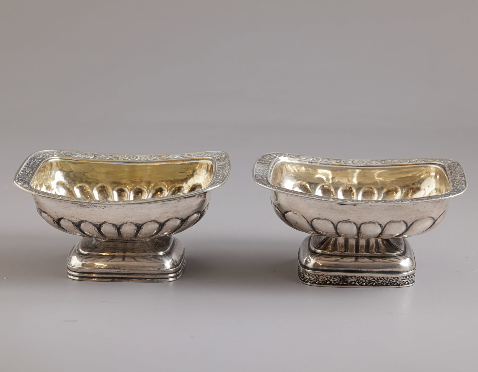 Russian Silver Salt Cellars, Aleksandr Ilyich Yashinkov: Pair of Russian 84 silver salt cellars by Aleksandr Ilyich Yashinkov, 1825, St. Petersburg. Decorated with floral motifs. Dimensions: 9.5X7.5 cm. Total weight: 162 grams. Hallmarked.