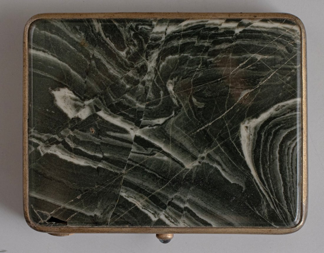Soviet Stone & Silver Cigarette Case: Soviet cigarette case made of stone and 875 silver. The clasp is inlaid with gold and set with gemstone. Dimensions: 7.5X1.5X9.5 cm. Hallmarked. Flaws to the stone.