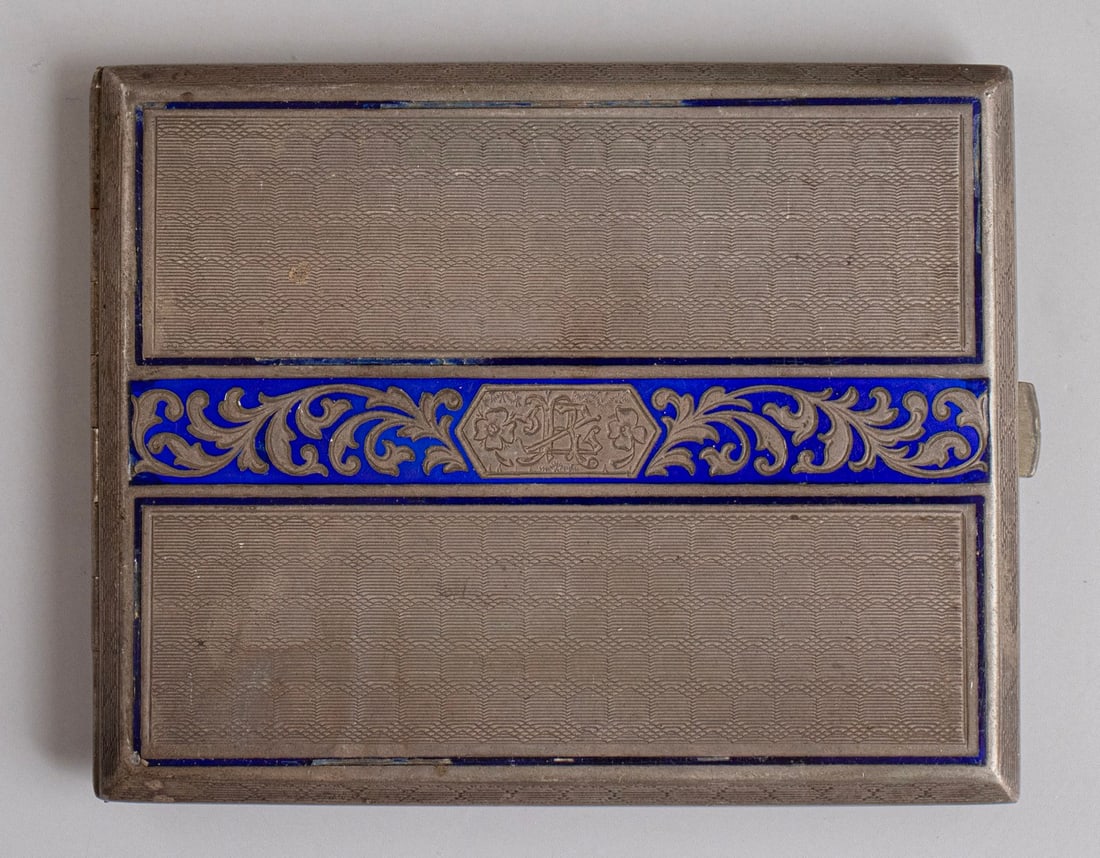 Silver & Enamel Cigarette Case, Austro-Hungary: Silver and enamel cigarette case, Austro-Hungary, late 19th – early 20th century. Decorated with enamel work of floral motifs and a monogram. Dimensions: 8X1.5X10.5 cm. Weight: 122 grams.