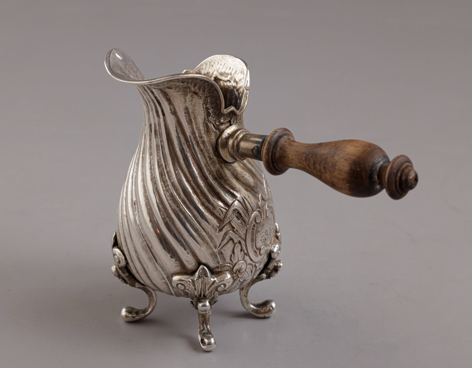 French Silver Milk Pot / Brandy Warmer: French silver milk pot / brandy warmer, 19th century. The handle of the pot made of wood. Height: 9 cm. Total weight: 104 grams. Hallmarked.