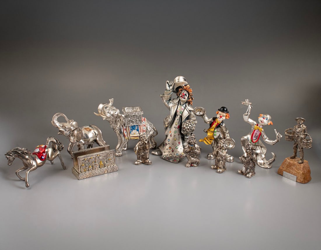 Electroforming Silver Figurines: Lot of 12 electroforming silver figurines, some by Hazorfim. In the form of figures, animals and a view of Jerusalem. Height/length: 8–19 cm. Hallmarked. A flaw to one figurine.