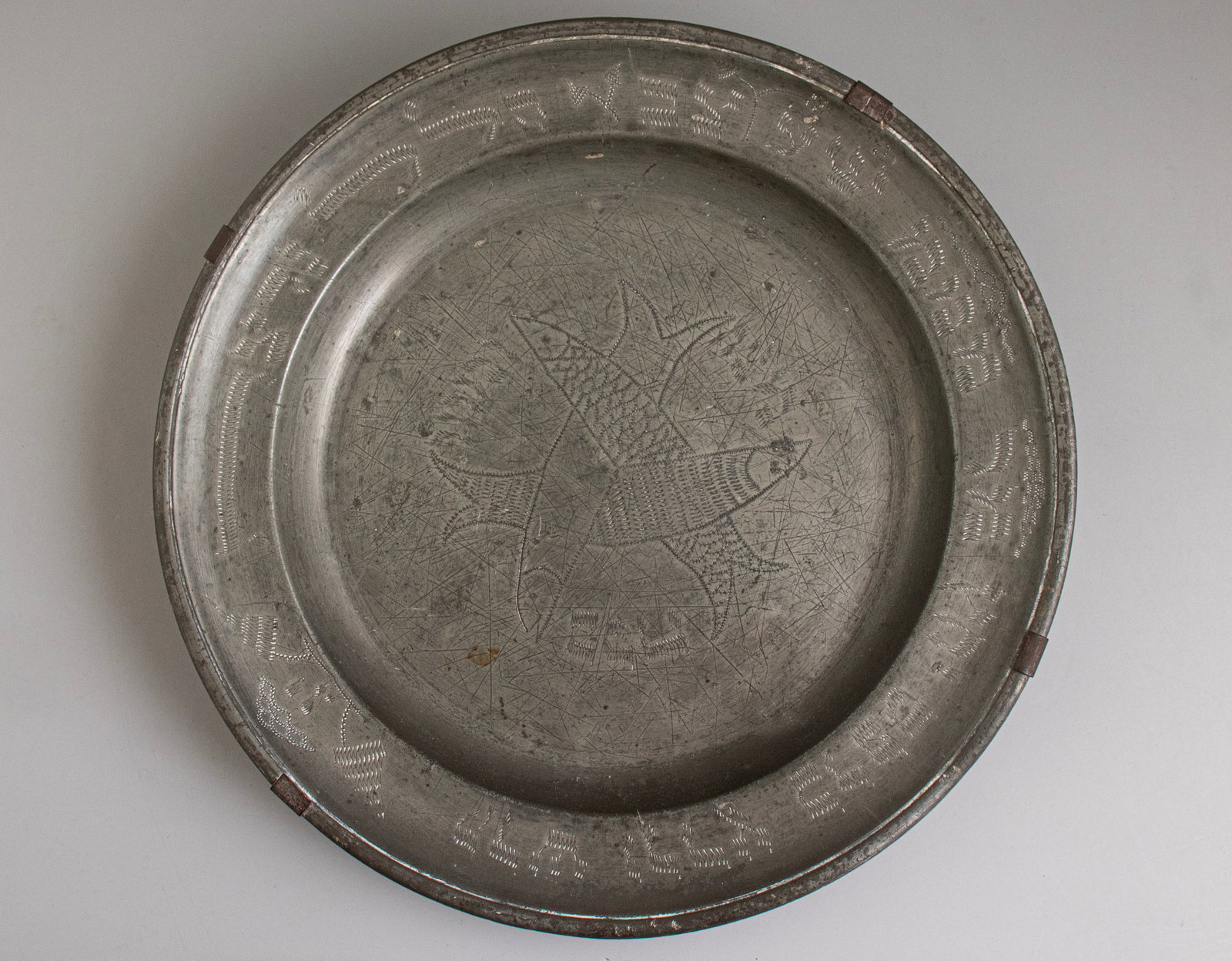 Pewter Plate for Passover: Pewter Passover plate, probably Alsace, 18th–19th centuries. Decorated at the center with fish and the inscription “Passover” in Hebrew, the rim is decorated with the Seder signs.