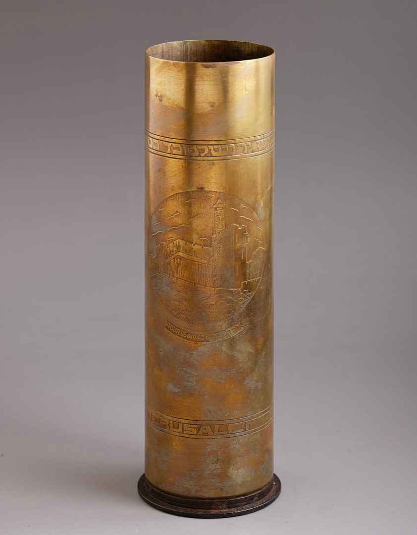 Brass Shell, Conquest of Jerusalem: Brass shell case by Raphael Abraham Shalem, etched depicting the Tower of David, a Star of David with the Tablets of the Law, and inscriptions: “Conquest of Jerusalem Dec 9 1917.” Height: 