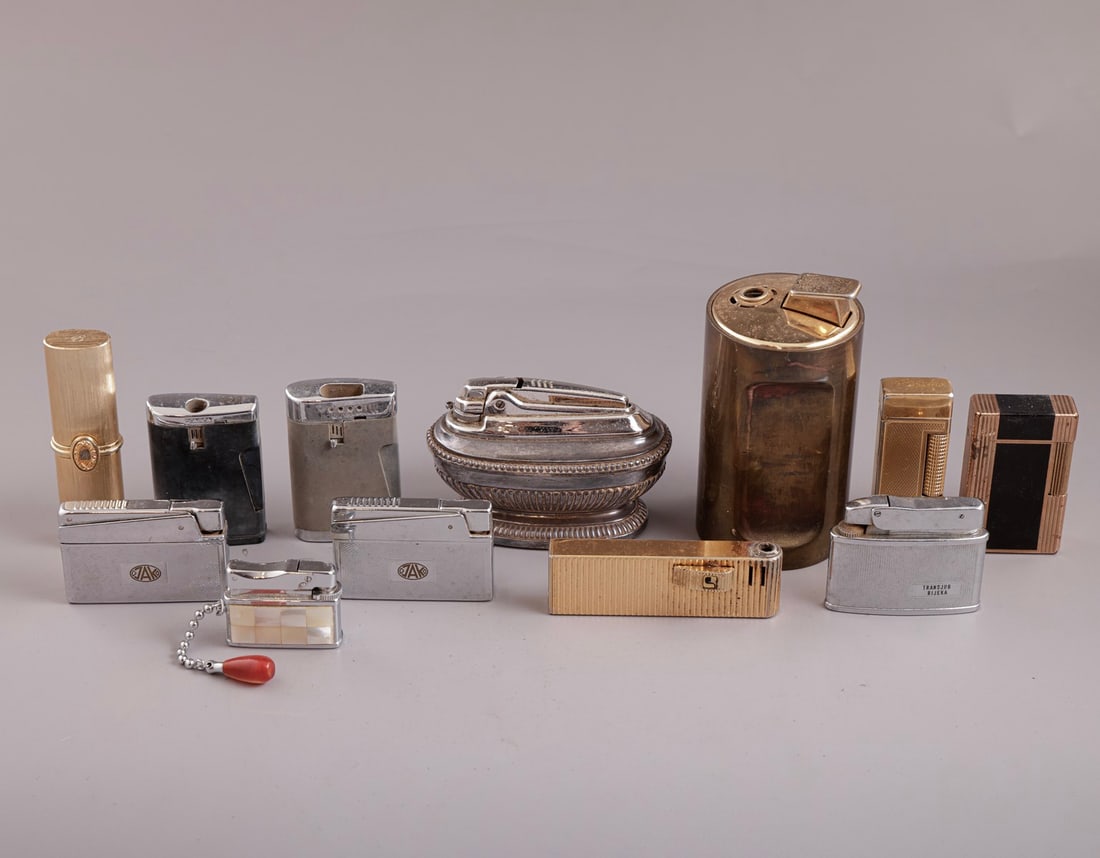 Lighters: Lot of 12 lighters, various makers, including Ronson, Sarome, Zenith, Skultuna, Maruman, and S.T. Dupont. Some in original boxes. Unknown working order.