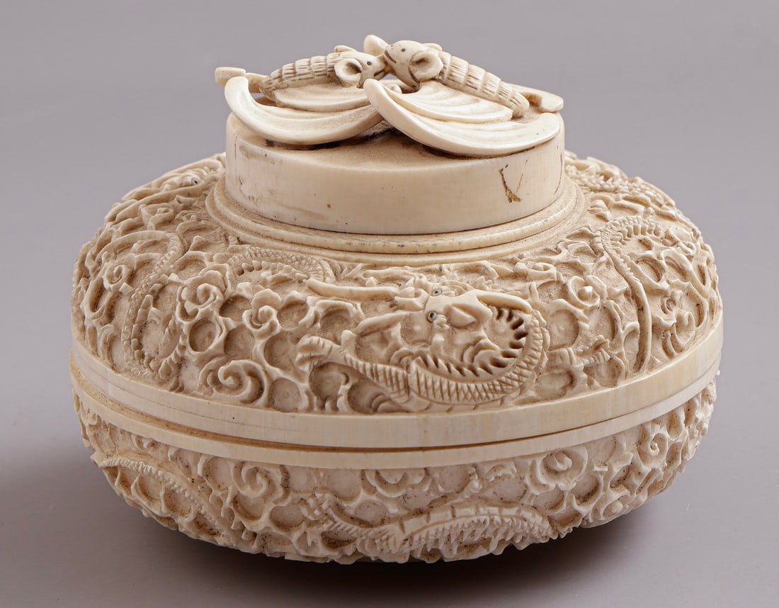 Carved Asian Box: Old Asian carved box, decorated with dragons and a pair of bats. Diameter: 10.5 cm. Signed.