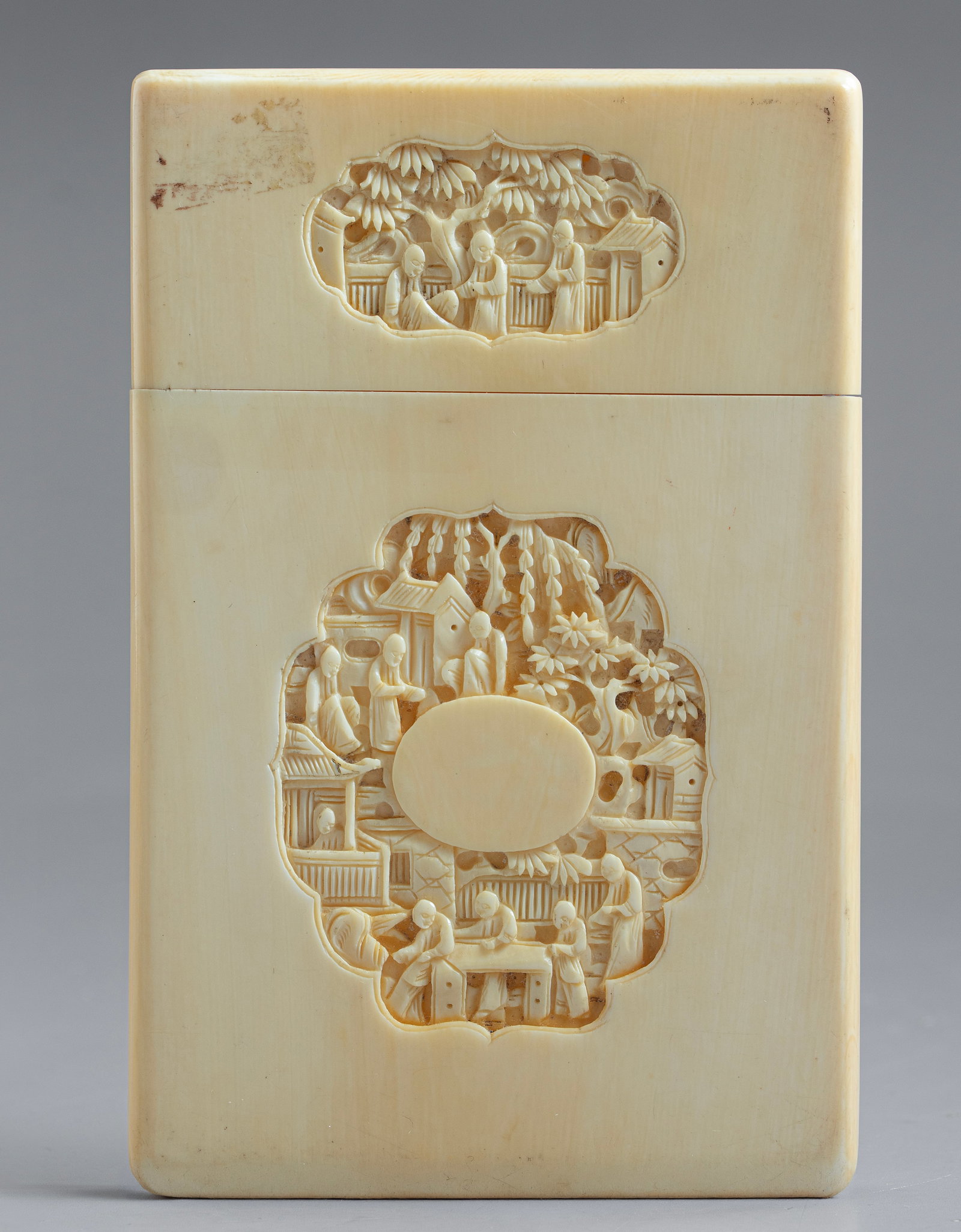 Carved Chinese Visiting Card Case: Chinese visiting card case, carved with scenes depicting figures, buildings, and floral motifs. Dimensions: 11.5X1X7.5 cm.