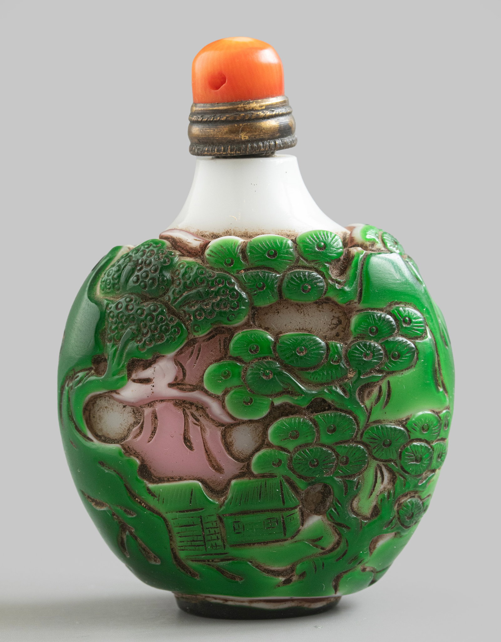 Chinese Peking Glass Snuff Bottle: Chinese hand-carved Peking glass snuff bottle, late Qing dynasty. Coral stopper. Height: 7 cm. Signed. A minor flaw to stopper.