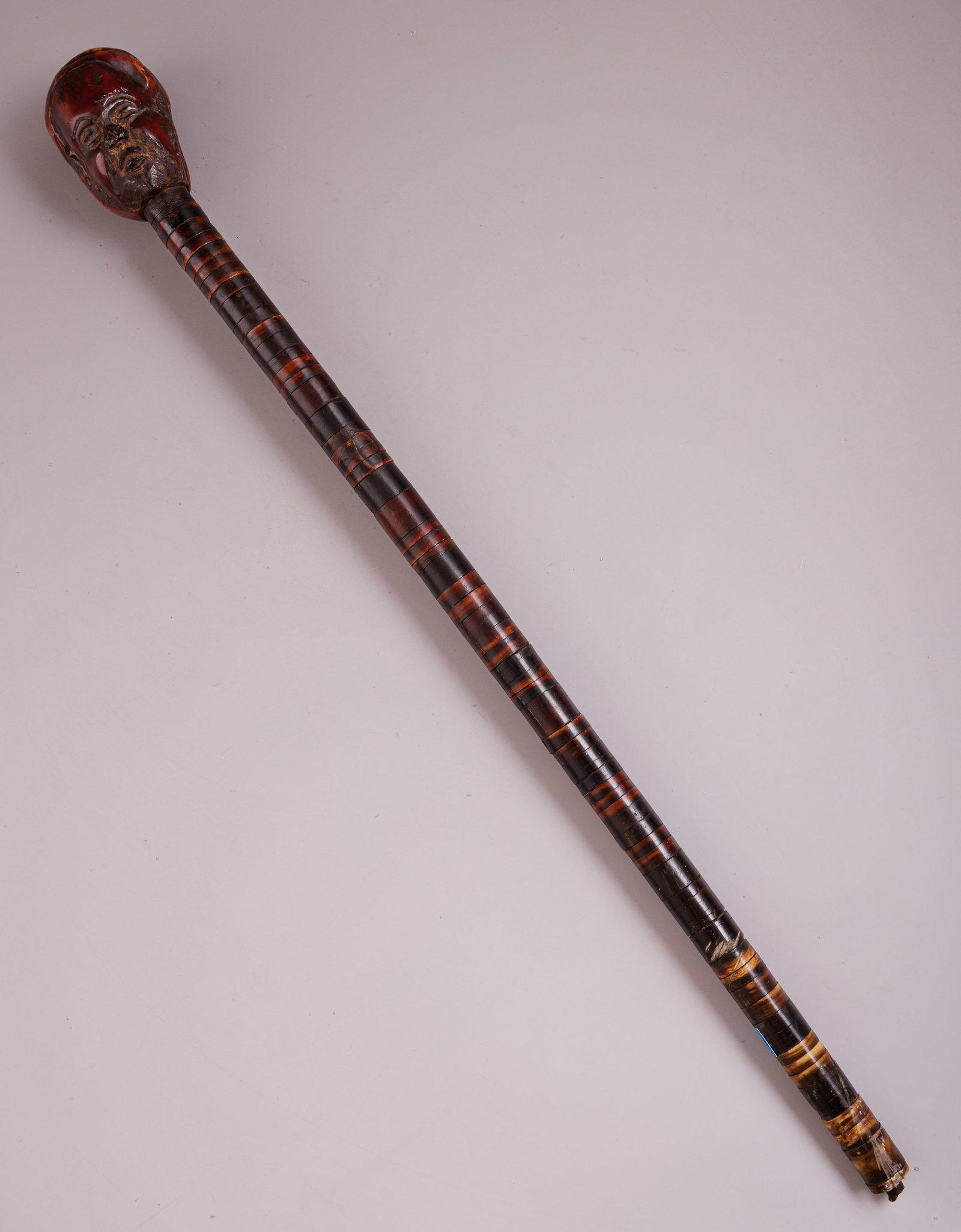 Carved African Stick/Wand: African stick/wand, made of horn, with a finial carved as a figure. Length: 44 cm. A missing part, minor flaws.