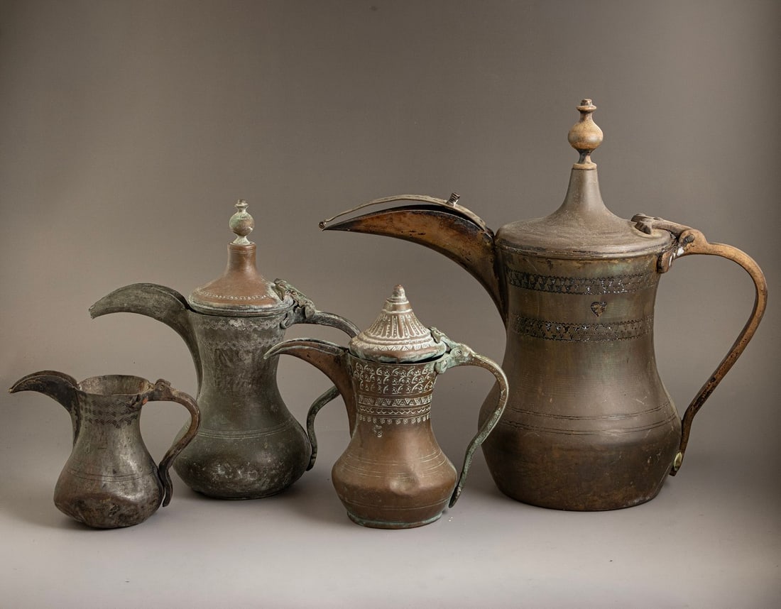 Islamic Copper Dallahs: Lot of 4 Islamic copper Dallahs, Central Asia. Height: 13-35 cm. Dents, 1 missing lid.