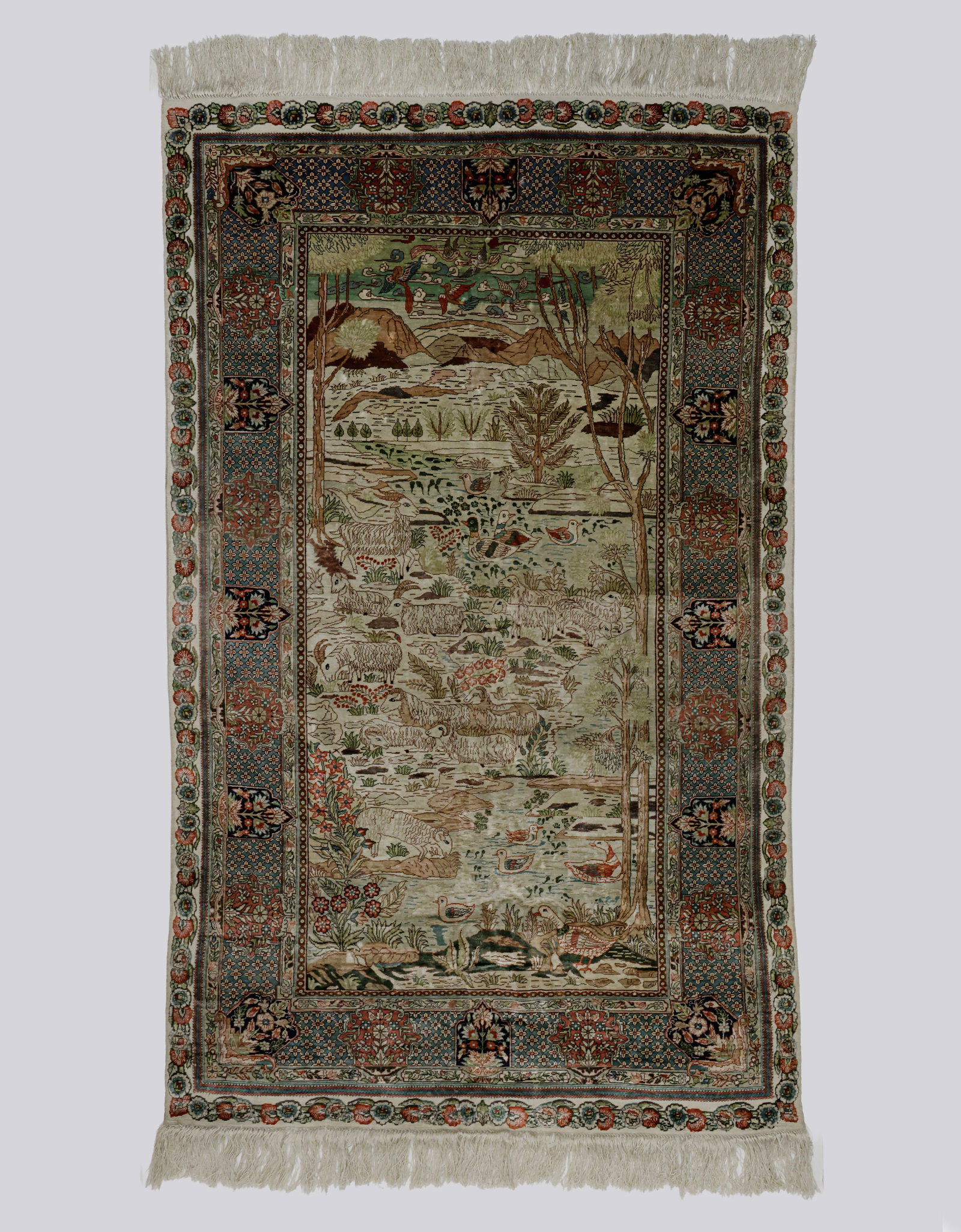 Silk Rug: Fine Persian silk rug. Decorated with animals and floral motifs. Dimensions (without strands): 153X92 cm. Minor wear.