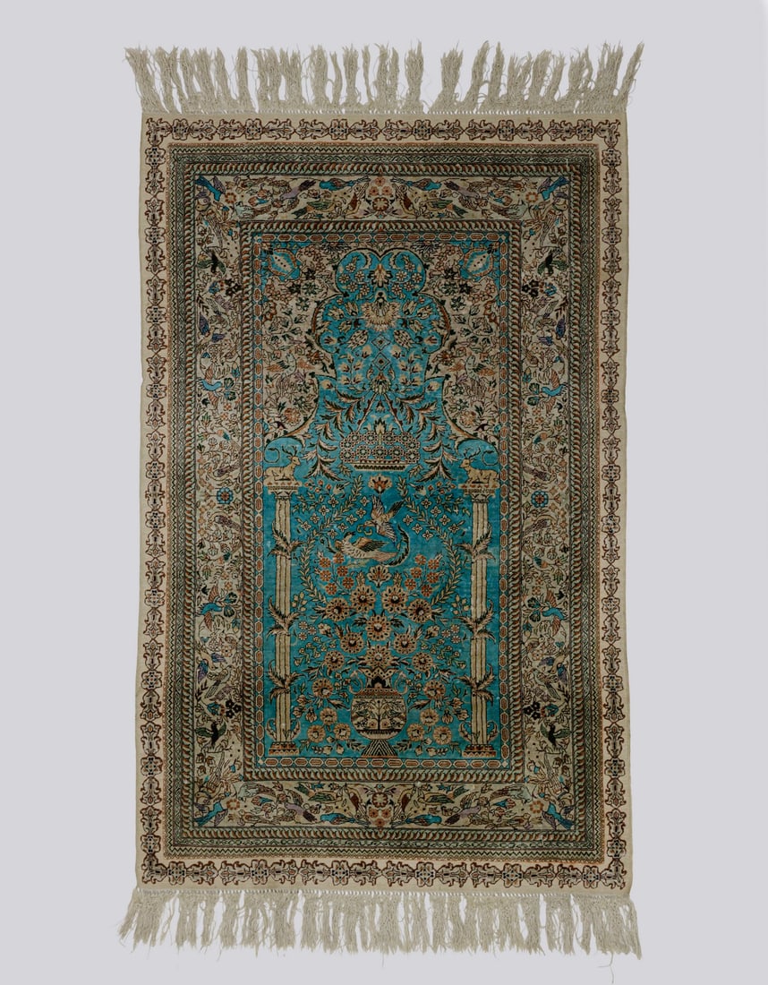Silk Rug: Fine Persian silk rug. Decorated with animals and floral motifs. Dimensions (without strands): 123X77 cm. Minor wear.