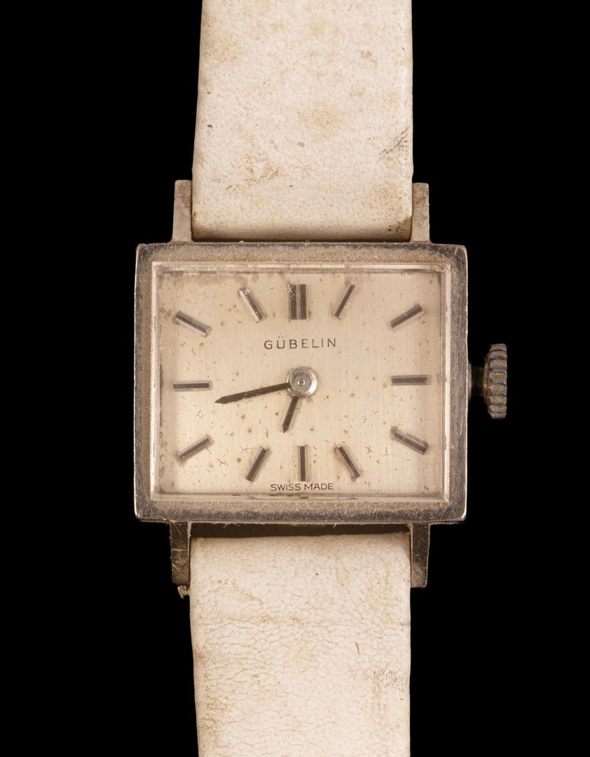 Ladies' Gold Watch, Gubelin: Ladies’ mechanical wristwatch by Gübelin, with an 18K white gold case and a leather strap. Dial dimensions: 18X15 mm. Total weight: 12.7 grams. Hallmarked. Unknown Working condition.