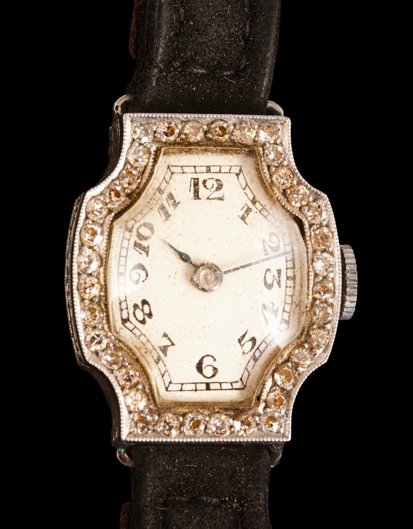 Ladies' Platinum Watch: Ladies’ mechanical wristwatch, with a platinum case set with 36 diamonds (approx. 1 point each), and a leather strap. Dial dimensions: 17X21 mm. Total weight: 13.9 grams. Hallmarked. Unknown