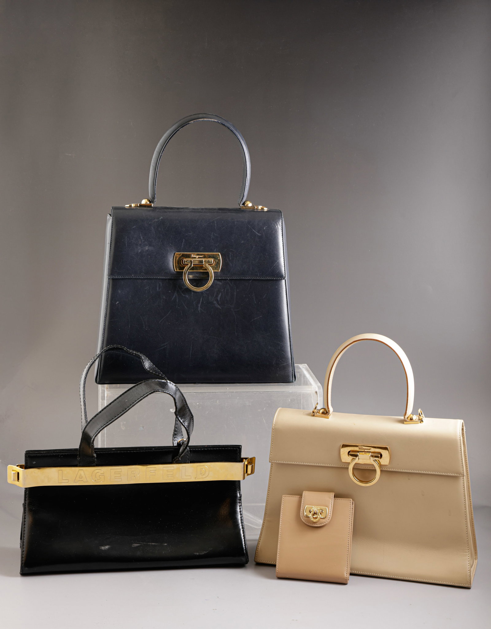 Women’s Handbags: Lot of 3 women’s handbags by Karl Lagerfeld and Salvatore Ferragamo. Various sizes and conditions.