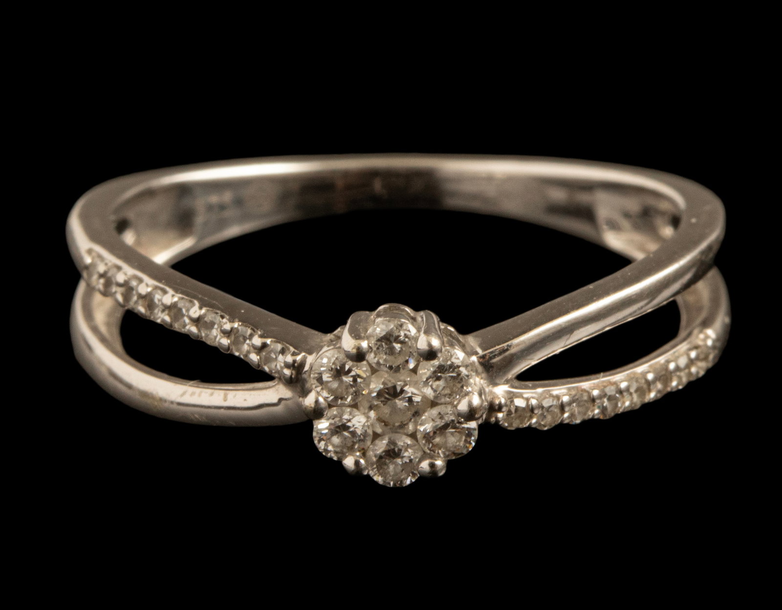 Gold Diamond Ring: 9K white gold ring set with 23 diamonds with a total weight of about 30 points. Size: 7 US, Weight: 1.9 grams. Hallmarked.