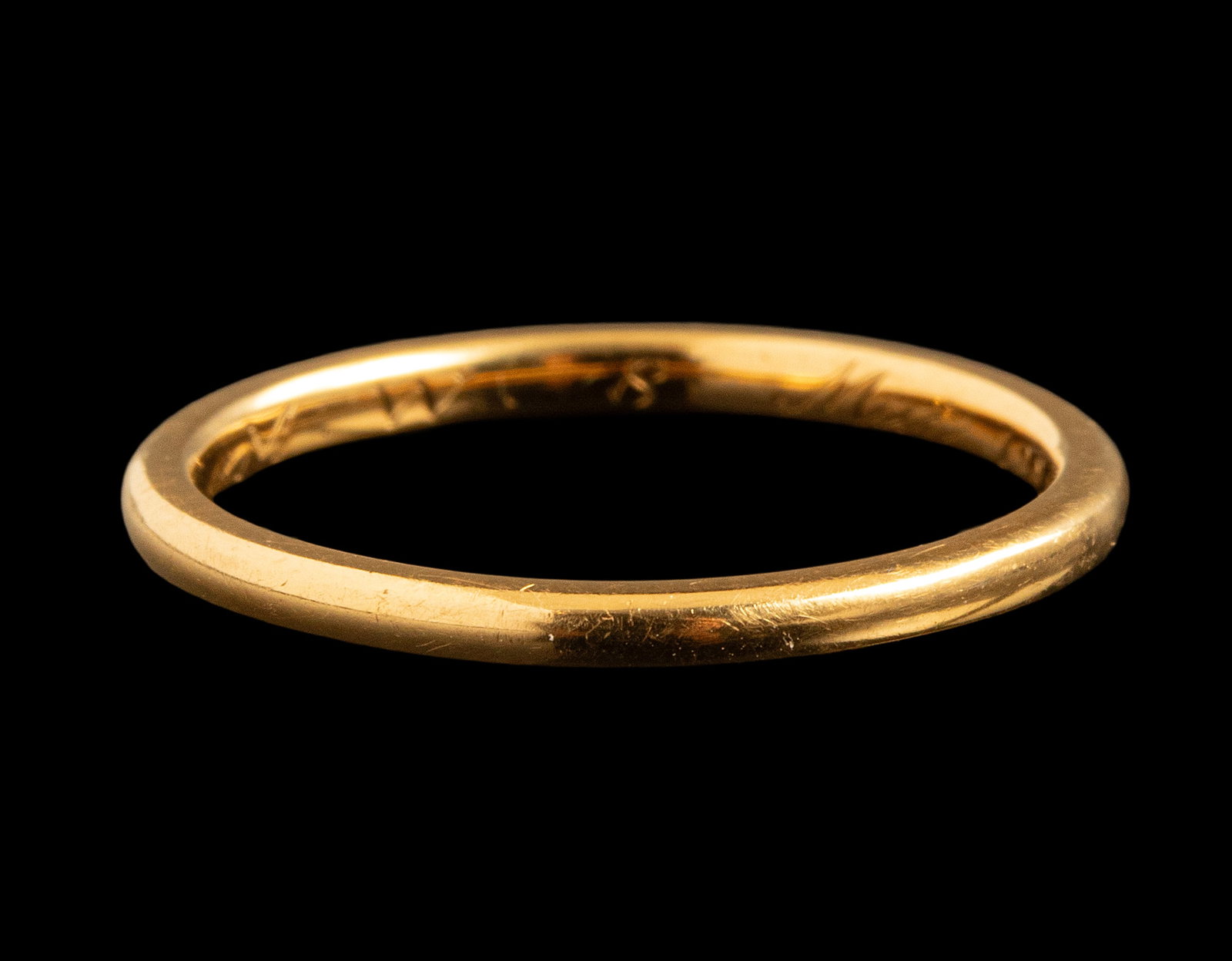 Gold Ring: 18K gold ring. Size: US 6.5. Weight: 2.11 grams. Unsigned, gold tested. Bears an engraved dedication.