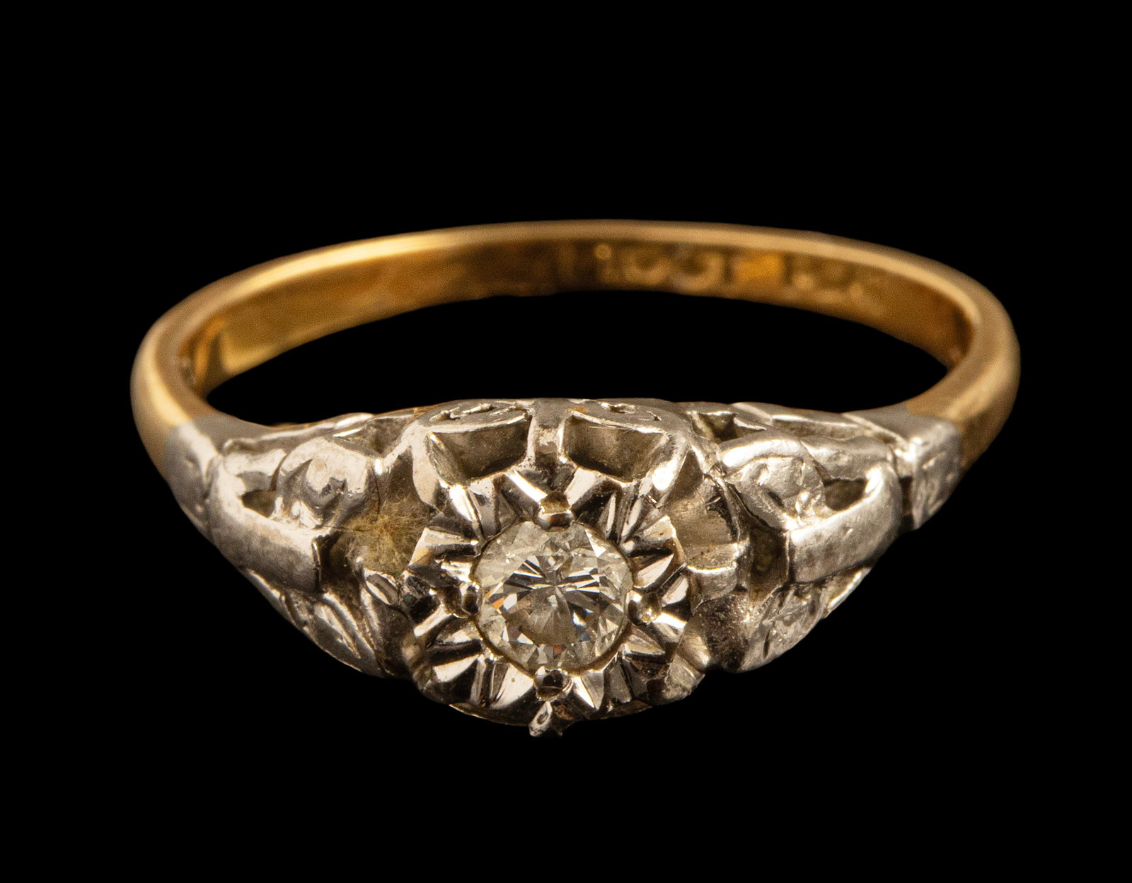 Gold Diamond Ring: 10K gold ring, set with a diamond weighing about 17 points. Size: 6 US, Weight: 2.8 grams. Hallmarked.