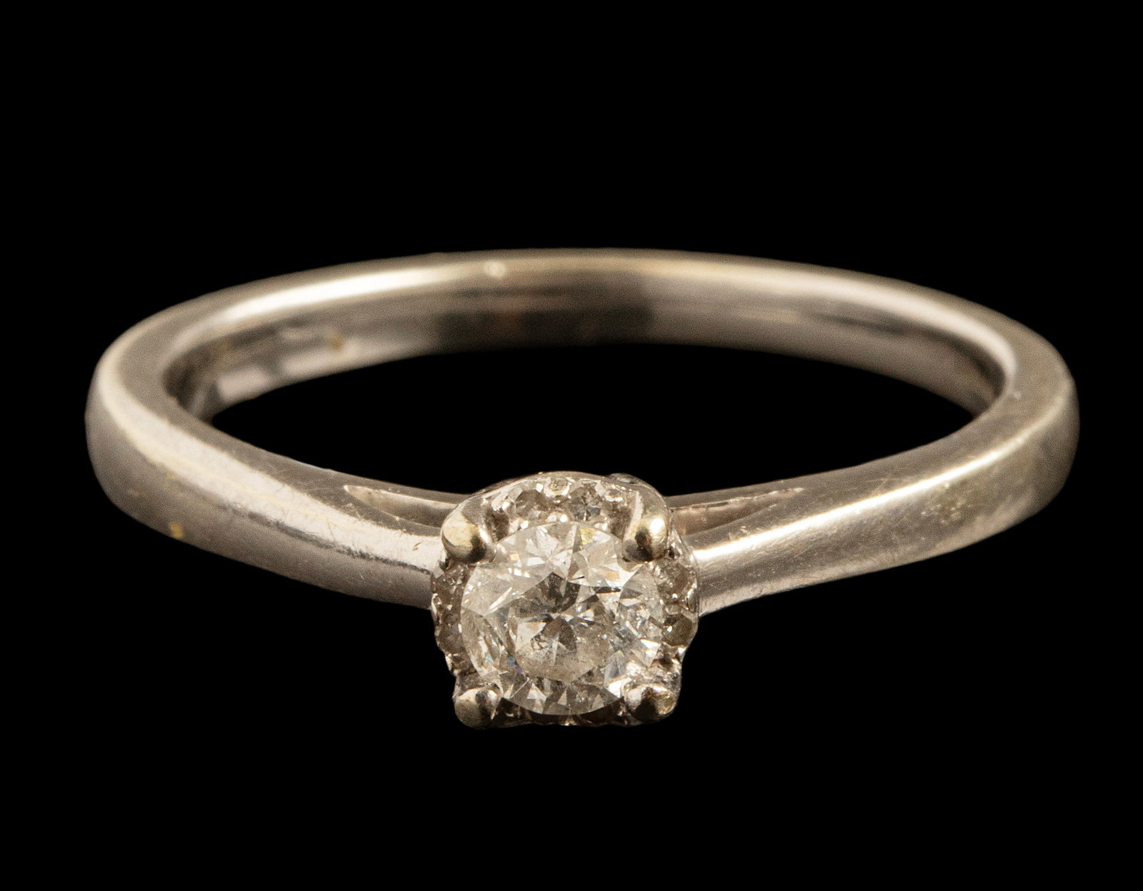 Gold Diamond Ring: 9K white gold ring set with a diamond weighing about 20 points, size: 6.5 US, weight: 2.5 grams. Hallmarked.