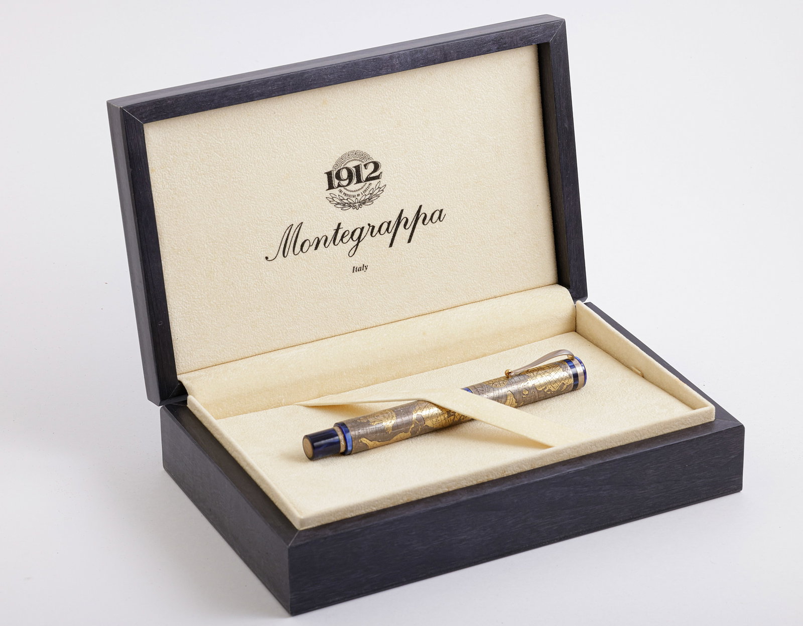 Montegrappa Gea 2001 Fountain Pen, Limited Edition: Montegrappa Gea 2001 fountain pen, Limited edition, sterling silver overlay. Size: 5.55" (14.1 cm). 2 toned 18K gold nib, M. Numbered 374/2001. Mint, in original case with certificate. Never inked.