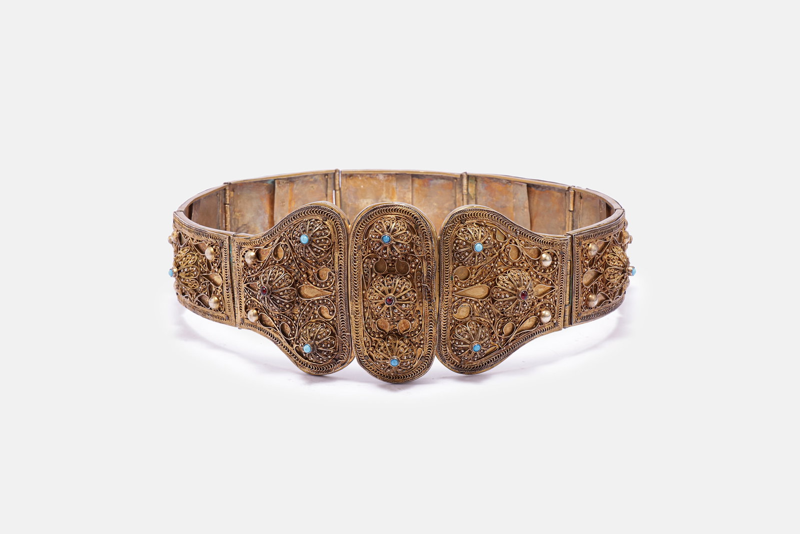 Caucasian Gilt Silver Belt: Large and impressive Caucasian gilt silver belt. Decorated in filigree and set with stones. Length: 88.5 cm. Total weight: 979 grams. Hallmarked.