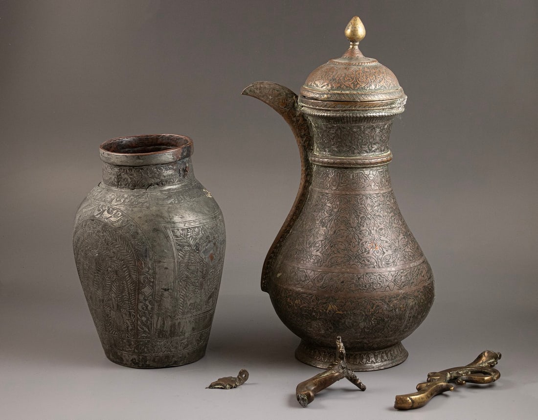 Persian Vessels: Lot of 2 Persian vessels, made of tinned copper, 19th century. Decorated with animals, floral, and calligraphic motifs. Height: 22–34 cm. Flaws and missing parts.