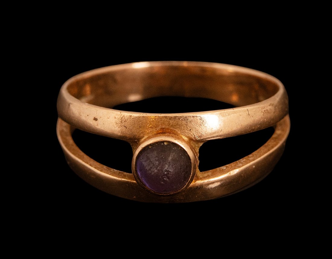 Gold Ring: 14K gold ring set with purple stone. Size: 7 US, Weight: 3.1 grams. Hallmarked.