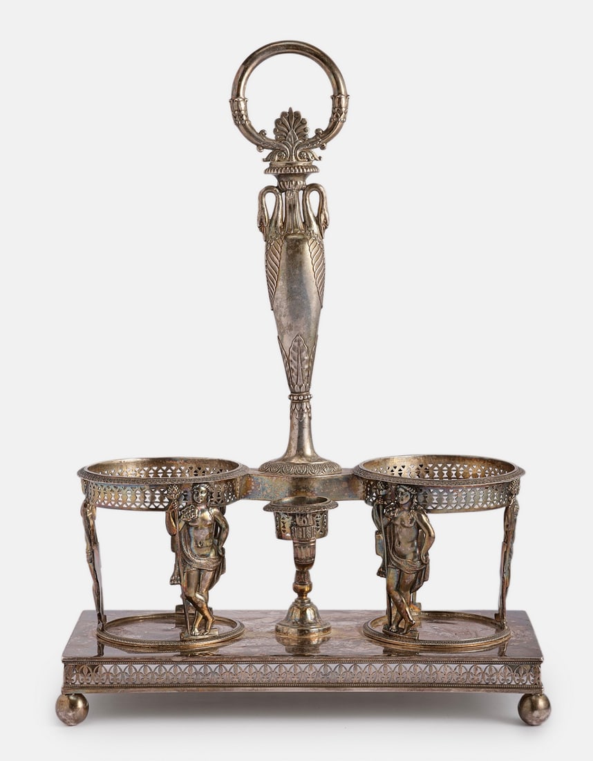 Empire Style Silver Cruet Stand, France: French Empire style silver cruet stand (Porte huilier-vinaigrier), ca. 1800. Decorated with Meanad figures, a handle shaped as a pair of swans and other neoclassical decorations. Height: 31.5 cm,